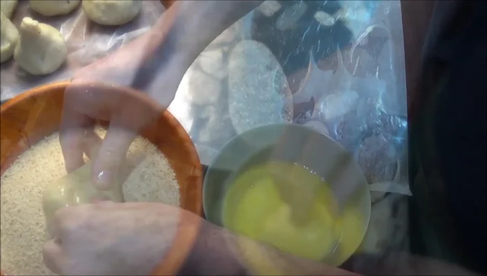 Bread the Coxinha: Dip in beaten eggs, then coat with breadcrumbs (309.72).