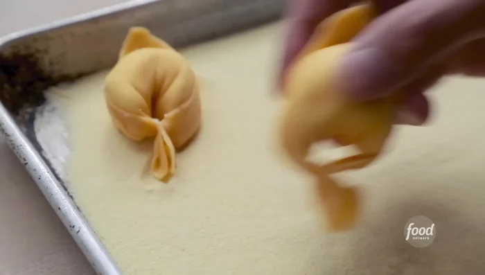 Cook the tortelli in boiling salted water until al dente.